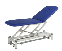 PICASSO XL electric treatment table: two sections with inclined backrest and variable height via motor.